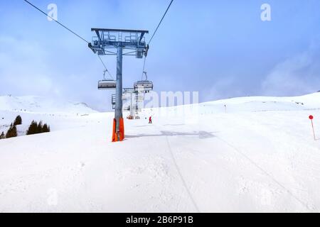 Ski chair lift and slope view in austrian resort Saalbach-Hinterglemm, Austria Stock Photo