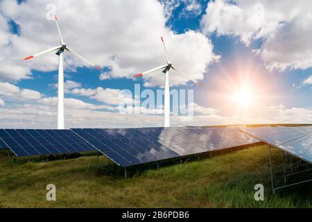 Photo collage of solar panels and wind turbins - concept of sustainable resources - Image Stock Photo