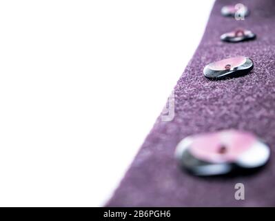 Colored button on a woolen cloth coat. Stock Photo