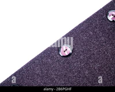 Colored button on a woolen cloth coat. Stock Photo