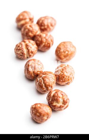 Hazelnuts with sugar icing isolated on white background. Stock Photo