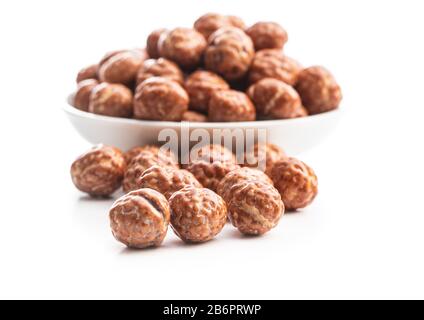 Hazelnuts with sugar icing isolated on white background. Stock Photo