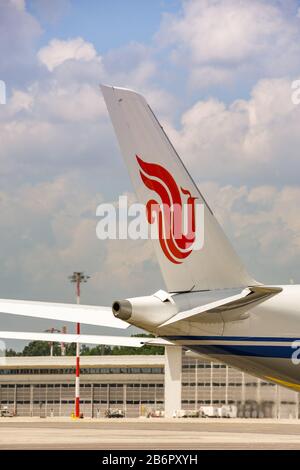 MILAN, ITALY - JUNE 2019: Tail fin of an Air China Airbus A350 900 jet at Milan Malpensa airport. Stock Photo