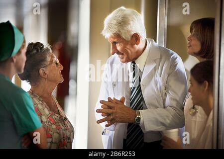 View of a doctor talking to an elderly woman. Stock Photo