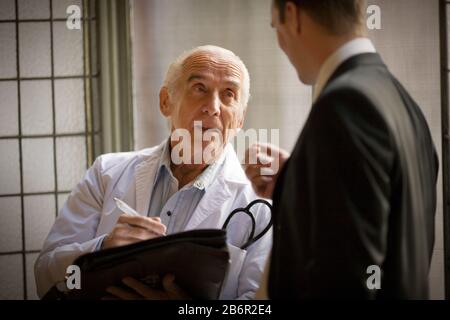 View of a doctor engrossed in a conversation. Stock Photo