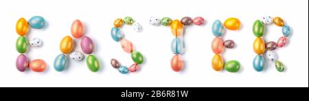 Easter banner. Multicolor colored eggs laid out the shape of the word Easter, isolated on white background. Stock Photo