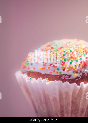 Little easter cupcake wrapped in white. Pink tone. Stock Photo