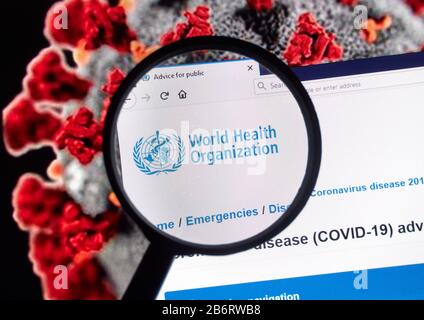 Montreal, Canada - March 11, 2020: World Health Organisation logo over Coronavirus picture. Coronavirus disease 2019 COVID-19 is an infectious disease Stock Photo