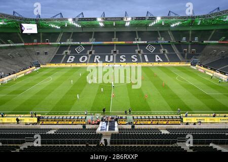 Monchengladbach. 11th Mar, 2020. Photo taken on March 11, 2020 shows the general view inside the stadium with empty seats during a German Bundesliga match between Borussia Monchengladbach and FC Cologne in Monchengladbach, Germany. Due to the COVID-19 outbreak, the match was held behind closed doors for the first time in Bundesliga history, accoring to German media. Credit: Ulrich Hufnagel/Xinhua/Alamy Live News Stock Photo