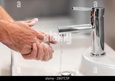Coronavirus virus spreading prevention wash hands with soap rubbing nails and fingers washing frequently with running water or using hand sanitizer gel. Stock Photo