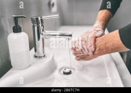 Washing hands rubbing with soap man for corona virus prevention, hygiene to stop spreading coronavirus. Stock Photo
