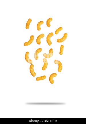 Puffed corn peanuts snacks falling. Isolated on white background with shadow. Selective focus. Stock Photo