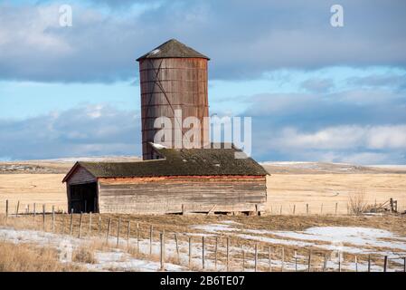 Old grain silo and barn on a farm in Wallowa County, Oregon. Stock Photo