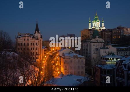 Evening view of Andriyivskyy Descent with Saint Andrew's Church in the background. Stock Photo
