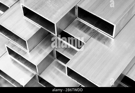 Aluminium profile for windows and doors manufacturing. Structural metal aluminium shapes. Aluminium profiles texture. Aluminum constructions factory b Stock Photo