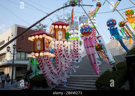 Aichi JAPAN - August 6, 2016: Traditional japanese paper decoration on bamboo poles. Anjo Tanabata festival Aichi Japan. evening time in motiom blur Stock Photo