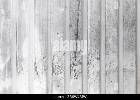 Grungy white corrugated metal wall, frontal background photo texture Stock Photo