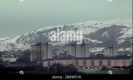 Glasgow, Scotland, UK, 12th March, 2020: UK Weather: Overnight snow was highlighted on the Kilpatrick hills in the north west of the city over the suburb of Drumchapel. Copywrite Gerard Ferry/ Alamy Live News Stock Photo