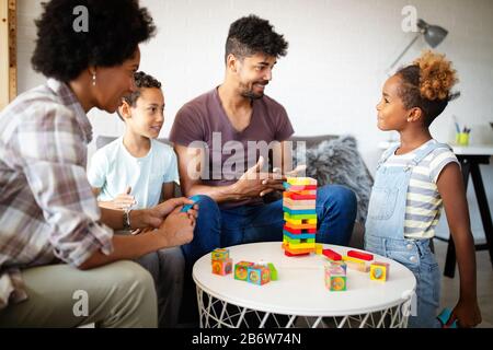 Happy black family playing game together at home Stock Photo