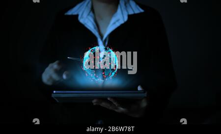 Business woman using a tablet computer, with hologram futuristic globe sphere, technology concept Stock Photo