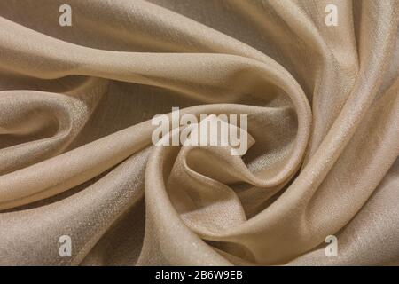 Shiny cloth background with beige vial textile Stock Photo