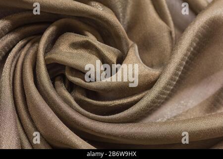 Shiny cloth background with beige vial textile Stock Photo