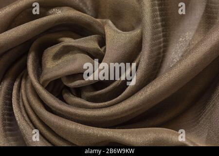 Shiny cloth background with beige vial textile Stock Photo