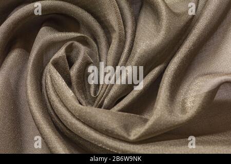 Shiny cloth background with beige vial textile Stock Photo