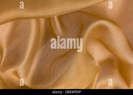 Shiny cloth background with beige vial textile Stock Photo