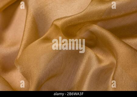 Shiny cloth background with beige vial textile Stock Photo