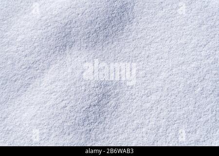 Photography of beautiful pure white snow texture. White snowflakes background rough pattern of snow texture. Stock Photo