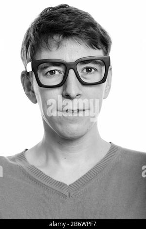 Face of nerd man with big eyeglasses looking at camera Stock Photo