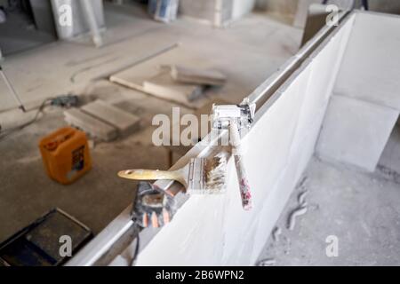 Tools on Gypsum plate. Construction of internal walls in the apartment using a plaster concrete plate with groove ridge. Stock Photo