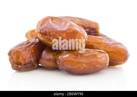 A pile of dried dates without stone. Isolated on white background with shadow reflection. With clipping path. With vector path. Stoneless dates on whi Stock Photo