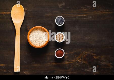 Different kind of spices on dark background. Stock Photo