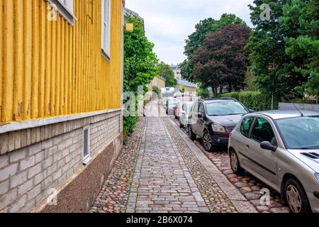View of famous old wooden house district in Turku, Finland is known as Martti. The district is one of the smallest in Turku. Stock Photo