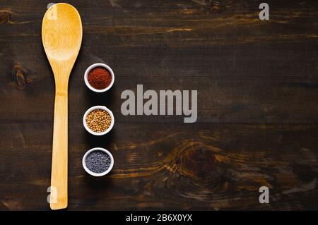 Different kind of spices on dark background. Stock Photo