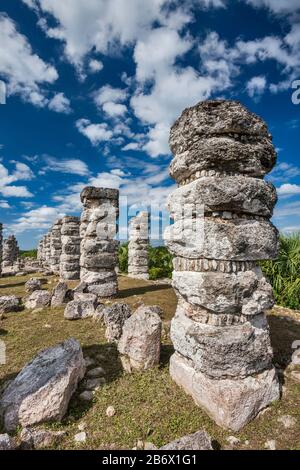 Stone columns at Edificio de las Pilastras, Maya ruins in Ake, Yucatan, Mexico Stock Photo