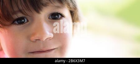 Beautiful Small Baby Portrait outdoors at nature. Soft Focus. Toned Photo with Bokeh and Copy Space Stock Photo