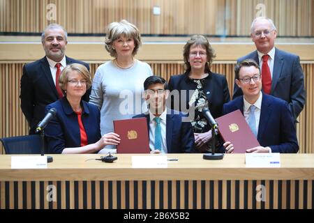 (back row, left to right) Councillors Shabir Pandor, Denise Jeffery, Judith Blake and Tim Swift, (front row, left to right) Susan Hinchcliffe, Chancellor Rishi Sunak and Simon Clarke MP after the signing of the West Yorkshire Combined Authority devolution, at the Nexus Building at the University of Leeds. Stock Photo