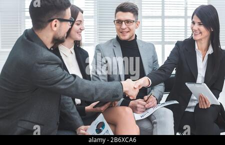 business colleagues greet each other at an office meeting Stock Photo