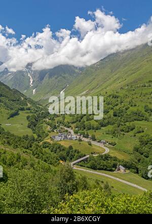 Village of Le Plan, Haute-Garonne, Occitanie, France.  The D118 leads through the village and to the mountainous  Pyrenees National Park beyond. Stock Photo