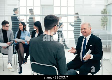 business man explaining something to his colleague. Stock Photo