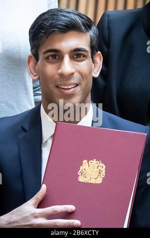 Chancellor Rishi Sunak with the signed West Yorkshire Combined Authority devolution deal during a visit to the Nexus Building at the University of Leeds. Stock Photo