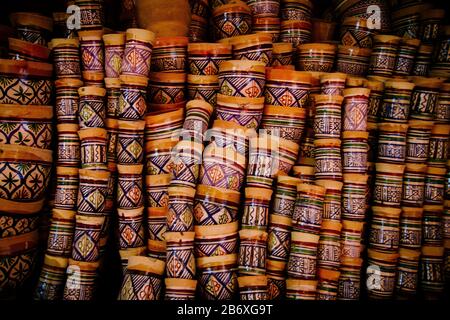 Painted clay pots stacked in a workshop in Fes, Morocco Stock Photo