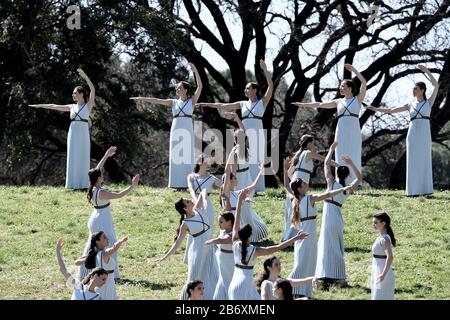 Olympia, Greece. 12th Mar, 2020. Actresses perform during the flame lighting ceremony for Tokyo 2020 Olympic Games in Olympia, Greece, March 12, 2020. Credit: Antonis Nikolopoulos/Xinhua/Alamy Live News Stock Photo