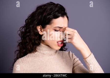 Close up photo attractive beautiful she her lady suffering strong terrible head ache eyes closed hold hand arm fingers nose bridge wear casual pastel Stock Photo