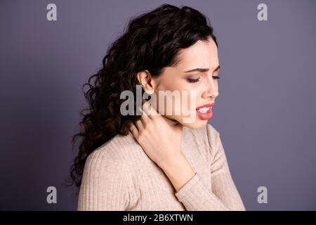 Close up side profile photo beautiful she her lady suffering strong terrible neck ache hold hand arm fingers hurt zone crying difficulties wear casual Stock Photo