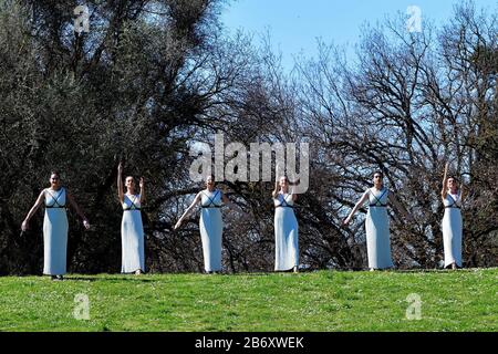 Olympia, Greece. 12th Mar, 2020. Actresses perform during the flame lighting ceremony for Tokyo 2020 Olympic Games in Olympia, Greece, March 12, 2020. Credit: Antonis Nikolopoulos/Xinhua/Alamy Live News Stock Photo