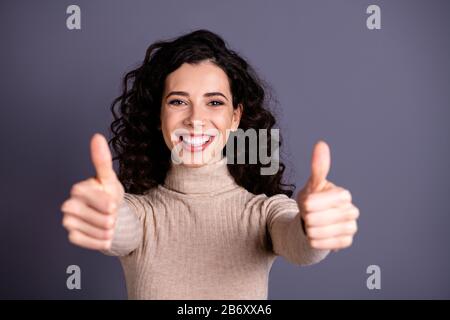 Close up photo attractive amazing she her lady volume cool hairstyle arms hands raised thumbs up symbol white teeth advising good job quality wear Stock Photo